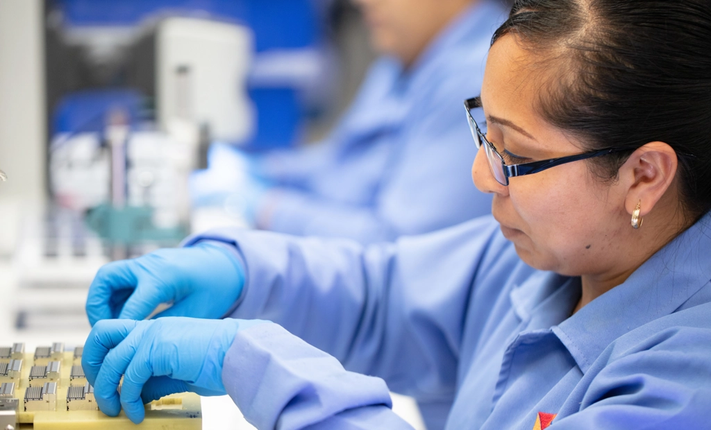 Employee Working With Fibre Optics Components