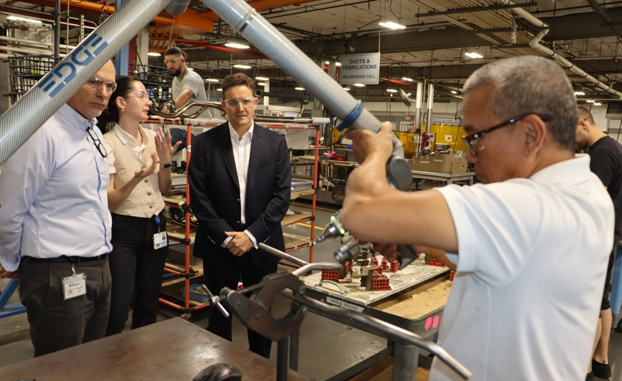 People Working In Factory During Site Visit