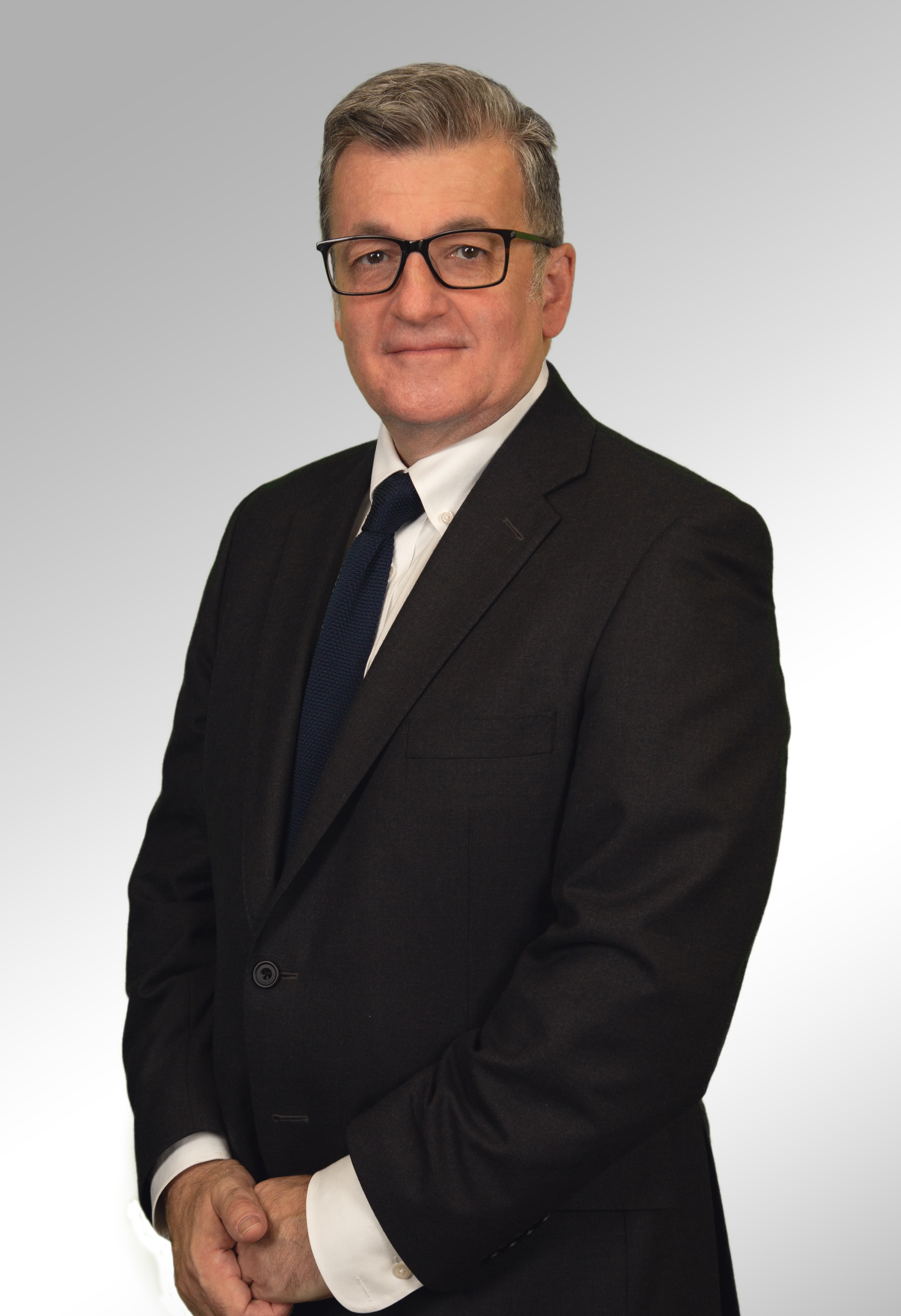 Roland Headshot Sep 2024 Copy