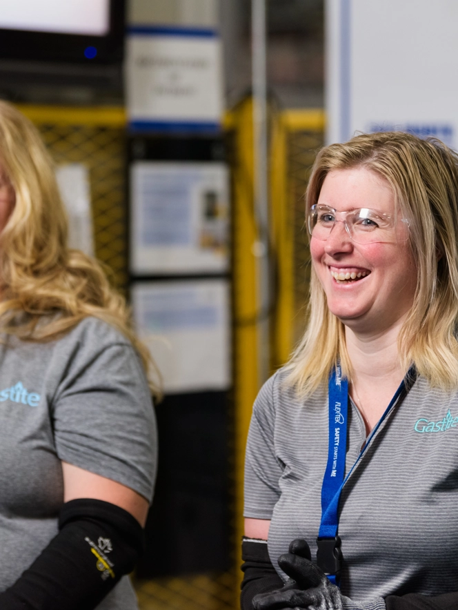 Two Females Smiling With Goggles