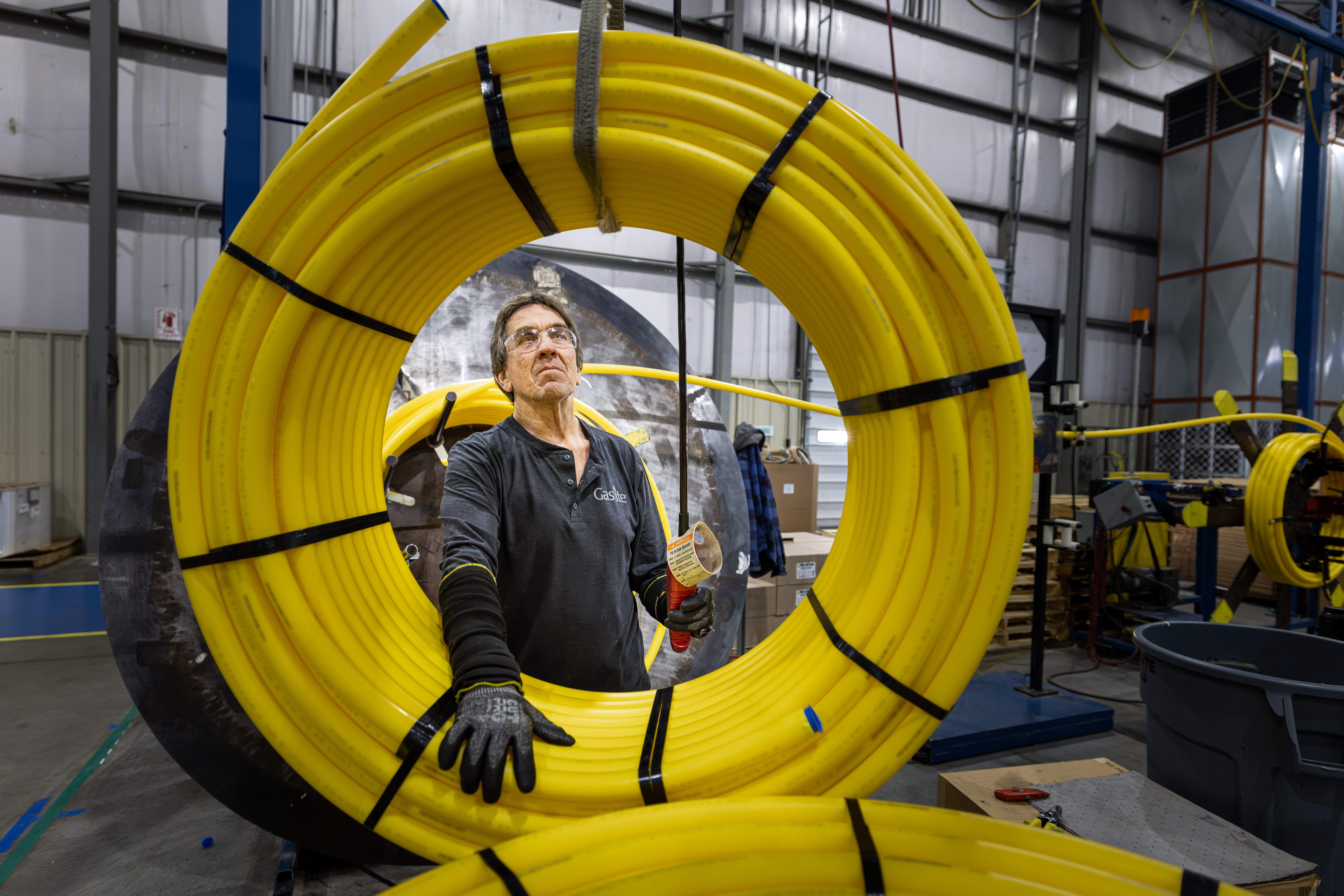Gastite Worker Inspecting Yellow Tubing