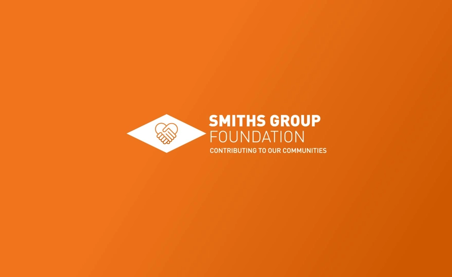 Smiths Group Foundation Logo On Orange Background