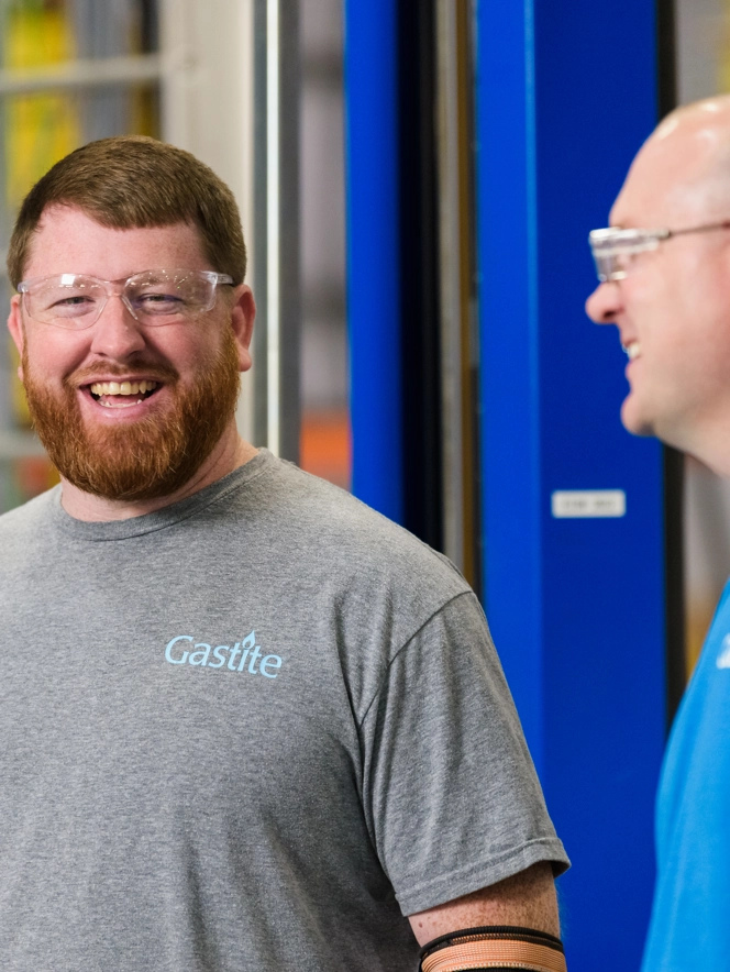 Two Colleagues In Goggles Laughing