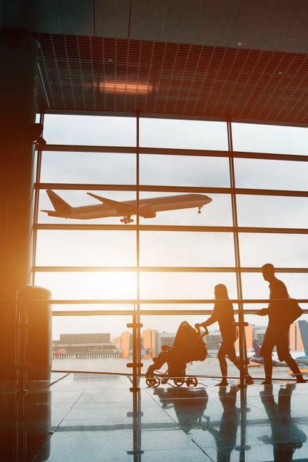 Family Walking Through Airport