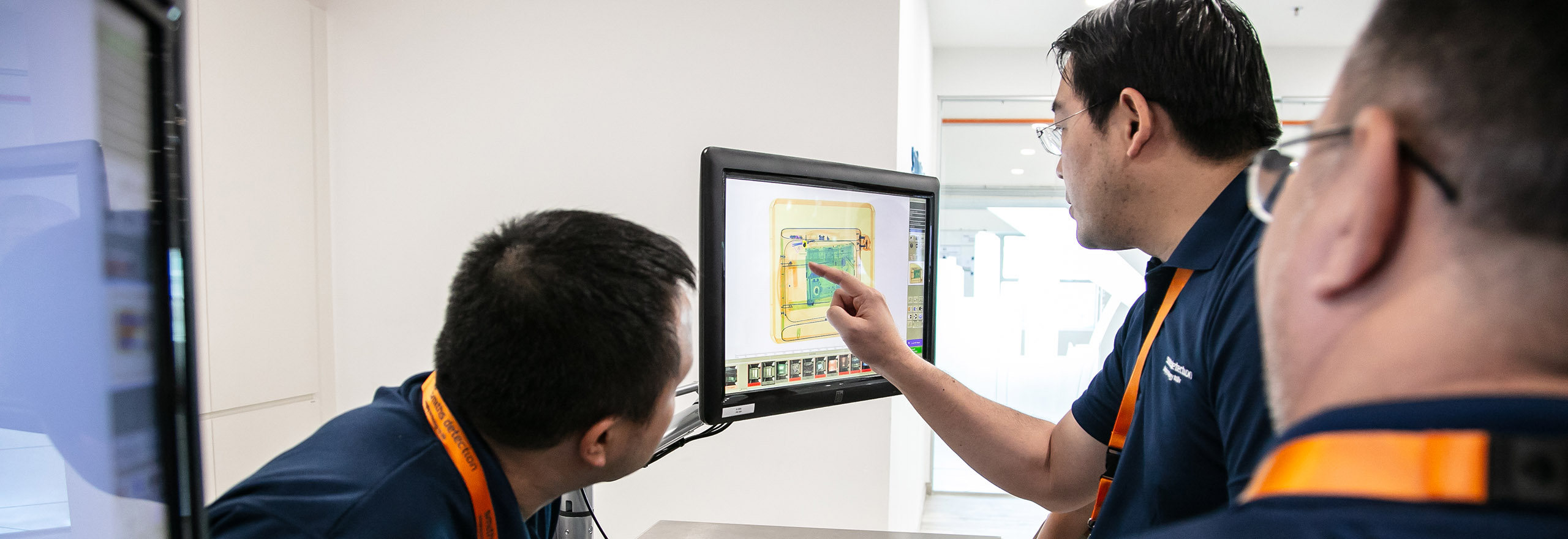 People inspecting scan