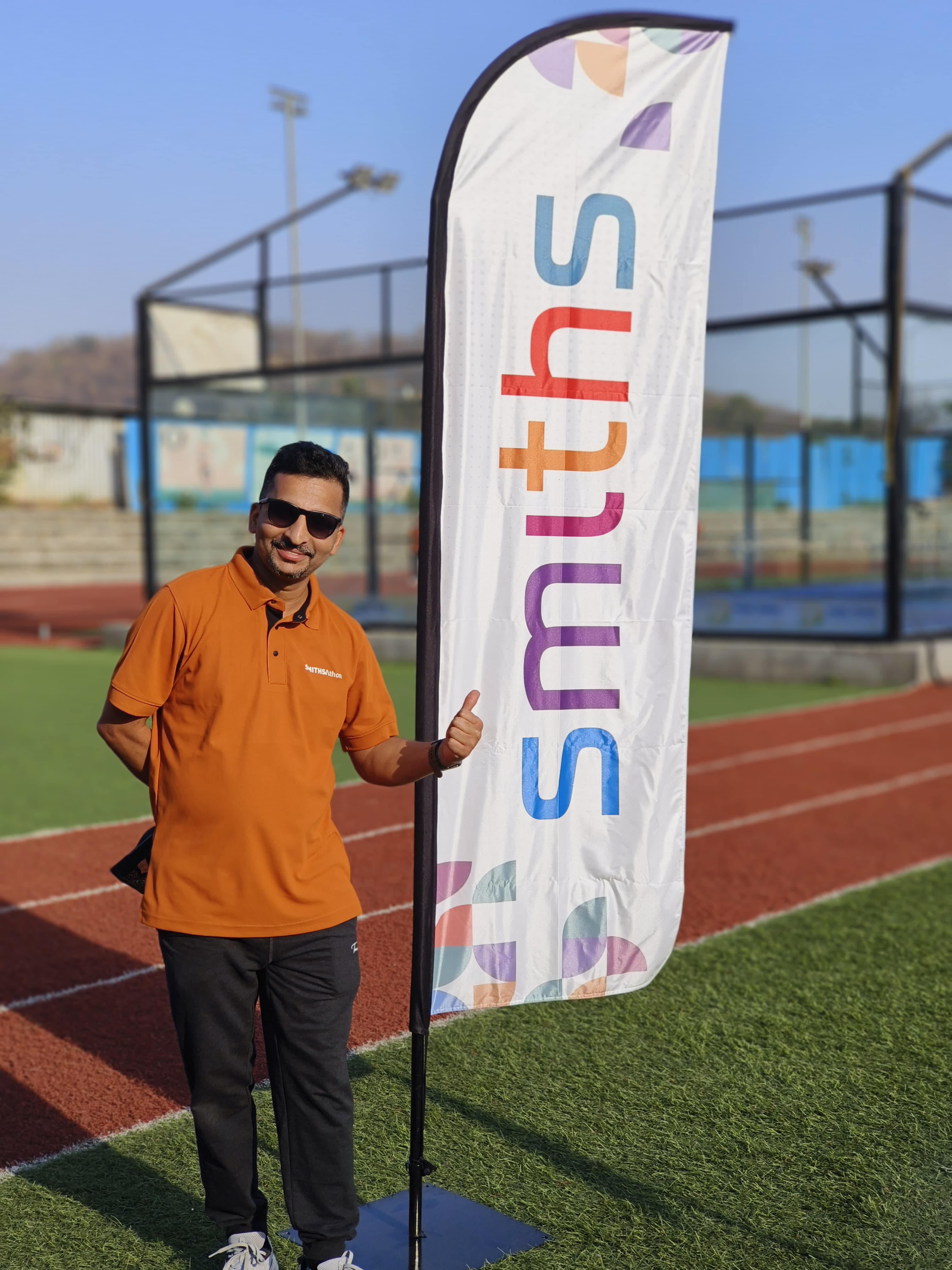 Portrait Of Prasad Beside Smiths Banner