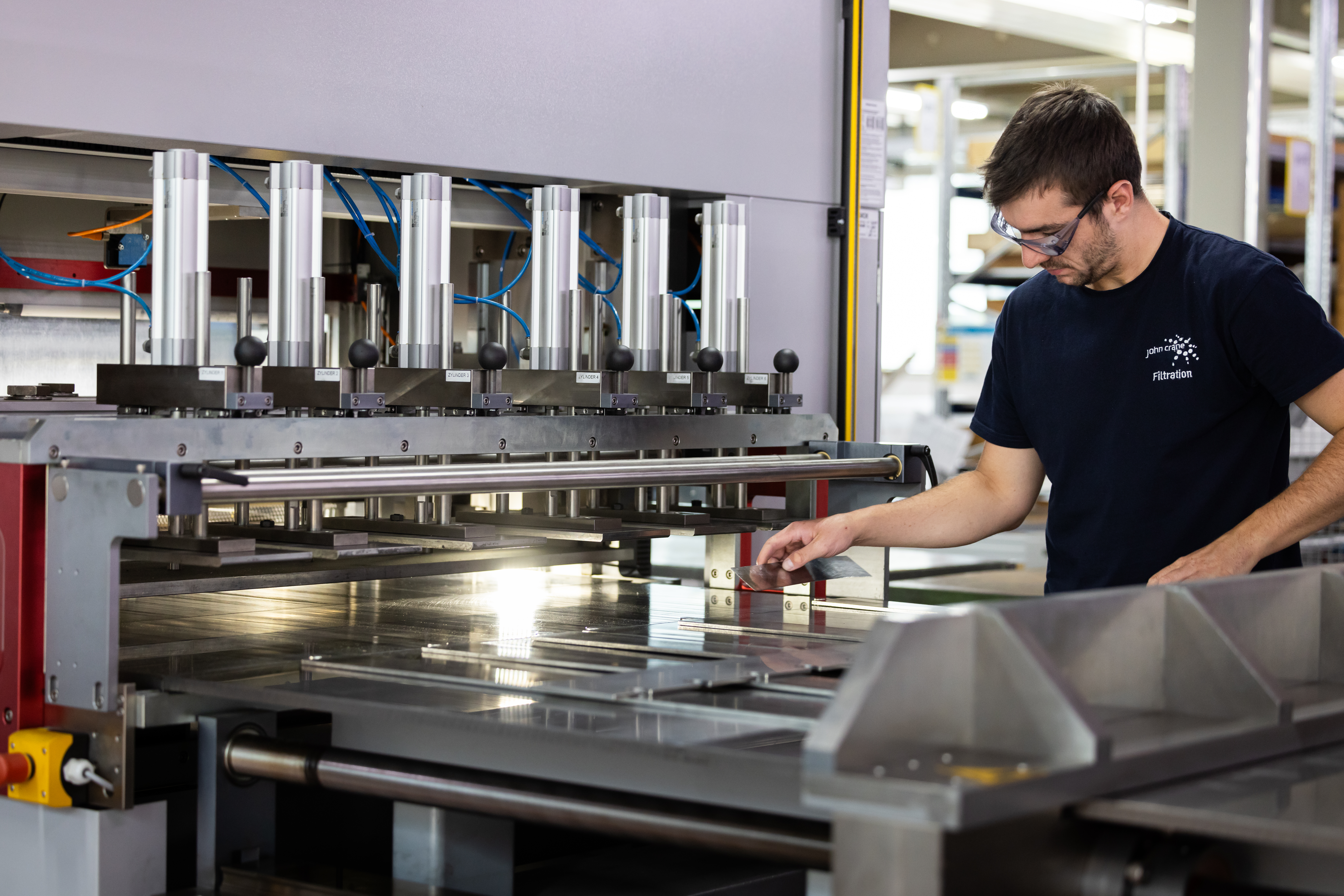 John Crane Worker Using Machine